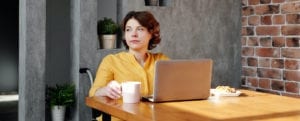 Woman at table, work-from-home