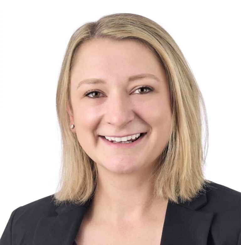 A headshot of associate Kimberly Ramirez, a smiling woman with shoulder length blonde hair.